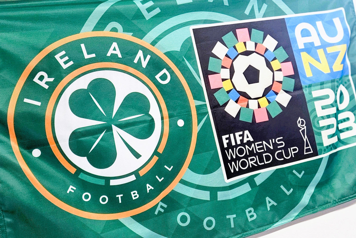 Flag with Ireland Football logo and FIFA Women's World Cup 2023 logo on a green background