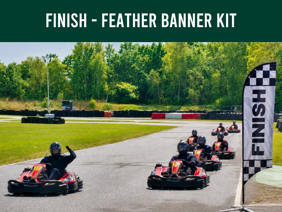 Go-kart race with 'Finish' feather banner on a track surrounded by trees