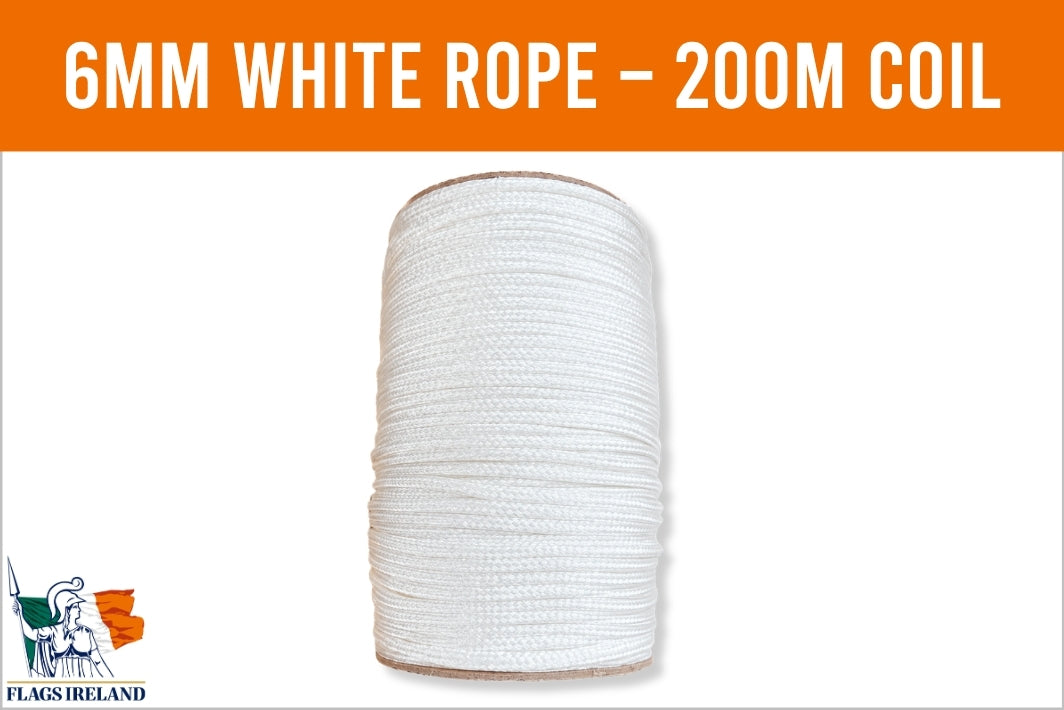 A spool of white rope centered on a white background with an orange banner at the top reading '6MM WHITE ROPE - 200M COIL' and a small 'Flags Ireland' logo in the lower left corner.