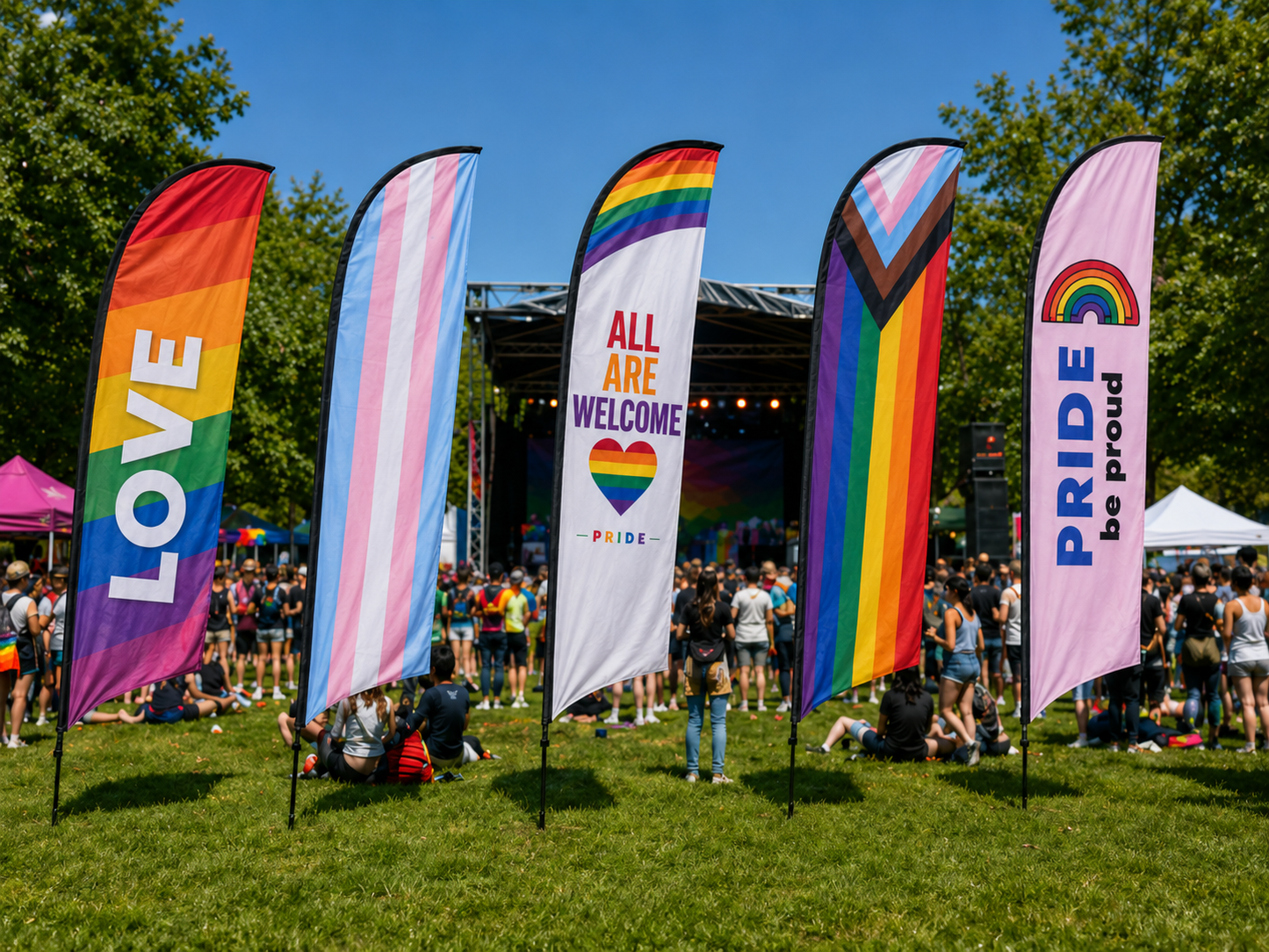 Colorful Pride feather banner flags on grass festival with people in the background