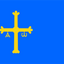 The flag of Asturias is a sky-blue field featuring a yellow "Cross of Victory" (Cruz de la Victoria) in the center, typically shifted toward the hoist, adorned with the Greek letters Alpha (\(\alpha \)) and Omega (\(\omega \)) hanging from its arms. This design, symbolizing the Christian Reconquista and the region's identity, has been used since the late 18th century.