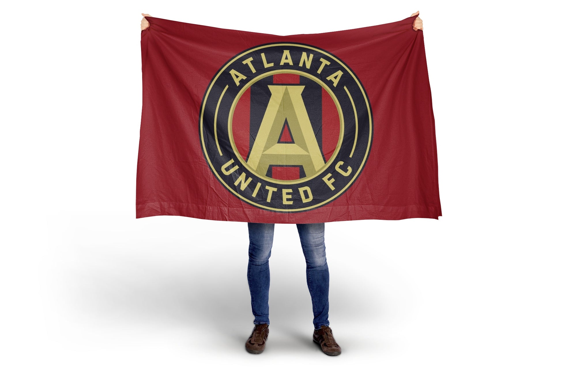 Person holding an Atlanta United FC flag on a white background