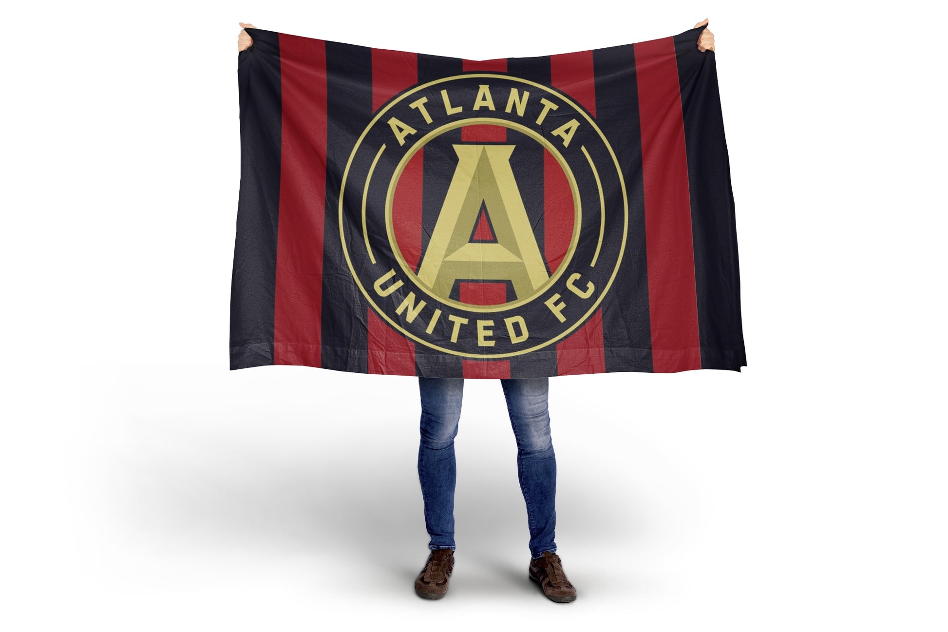 Person holding a Atlanta United FC flag on a white background