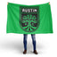 Person holding a green flag with 'Austin FC' logo on a white background