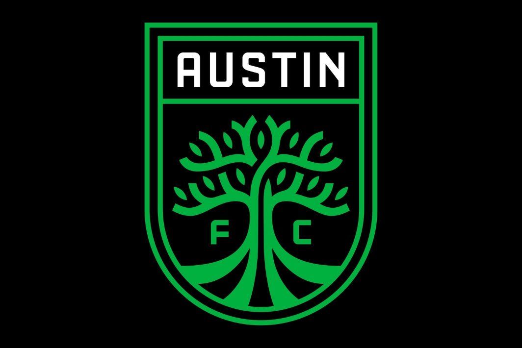 Green logo of Austin FC with a tree design on a black background