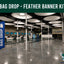 Bag drop area with a blue feather banner labeled 'Bag Drop' in an airport terminal.