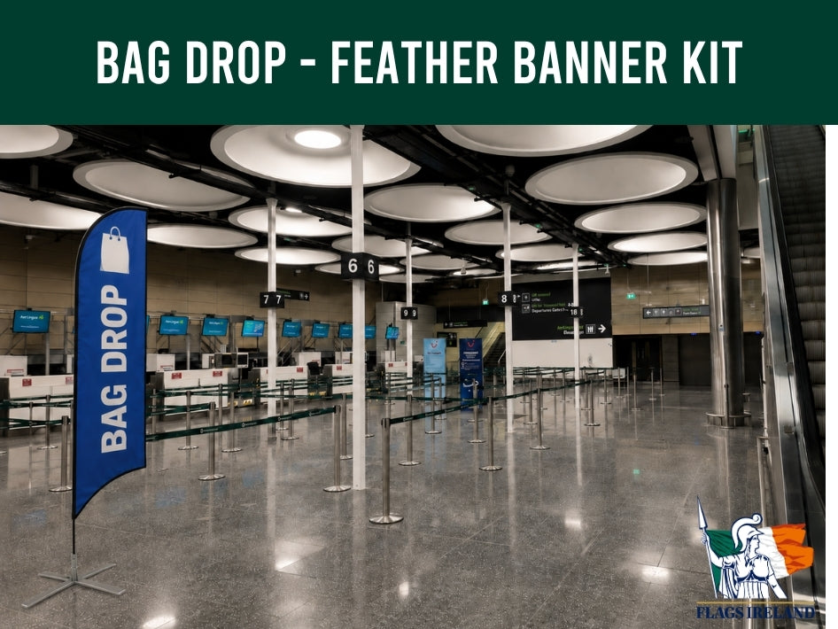 Bag drop area with a blue feather banner labeled 'Bag Drop' in an airport terminal.
