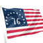 A 1776-style American flag with 13 white stars in a blue canton and alternating red and white stripes, shown waving on a white flagpole against a plain white background.