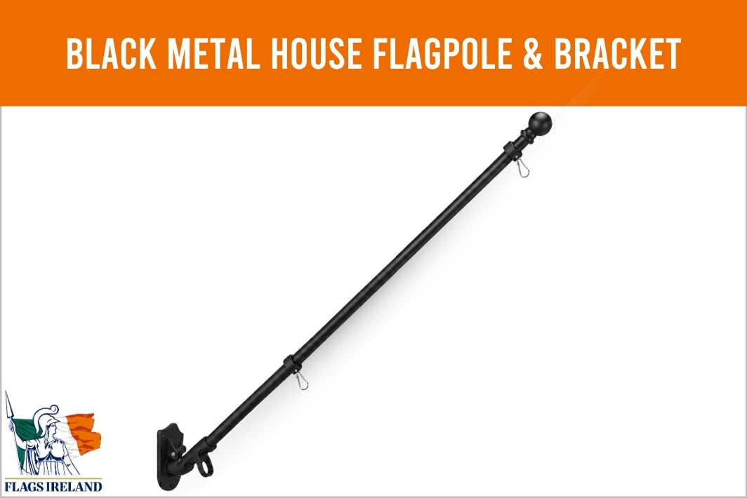 A black metal house flagpole and bracket set shown diagonally on a white background with an orange header reading 'BLACK METAL HOUSE FLAGPOLE & BRACKET'. A small 'Flags Ireland' logo appears in the bottom-left corner.