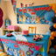 Children's birthday party setup with a 'Happy 3rd Birthday Liz' banner and decorations.