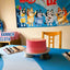 Birthday party setup with a pink cake, cupcakes, and a Bluey-themed banner on a table.