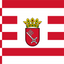 Bremen Middle Arms State Flag. A red and white flag design with a red-and-white checkered quarter in the hoist, horizontal red stripes across the white center, and a central coat of arms featuring a crown, shield, and crossed elements.