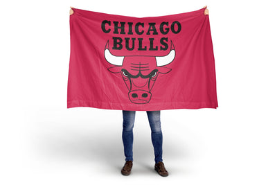 Person holding a Chicago Bulls red flag on a white background