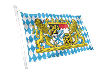 A Bavarian flag on a white flagpole, featuring the traditional blue and white diamond pattern with the central coat of arms and two golden lions, isolated on a white background.