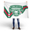Cork City F.C. Diagonal Stripe Flag with modern crest in red, white and green being held up.