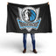 Person holding a Dallas Mavericks flag against a white background