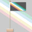 Colorful striped flag with a wooden base on a gray background. Disability Pride - Updated Version