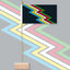 Colorful zigzag patterned flag with a wooden base on a gray background. Original Disability Pride