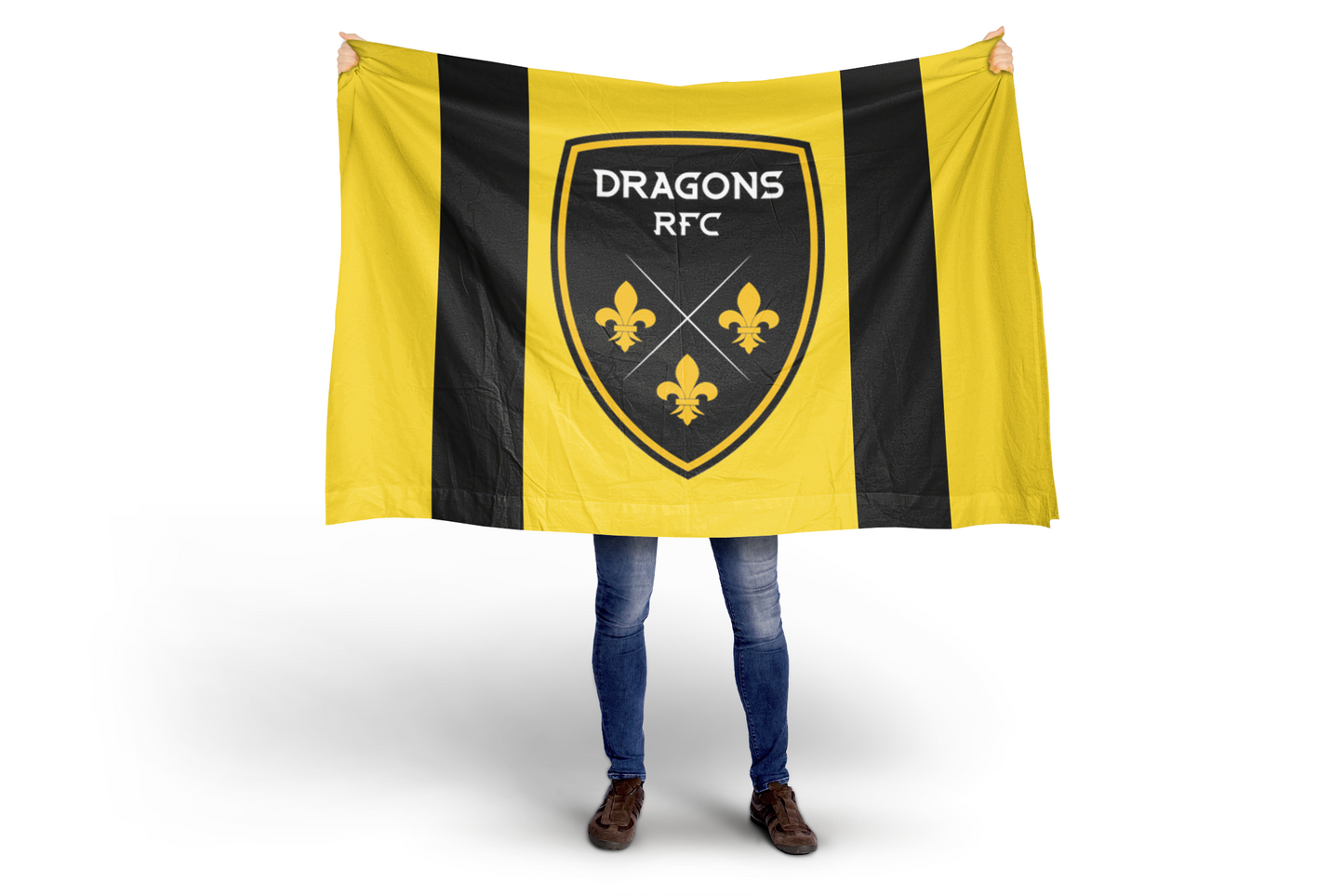 Person holding a Dragons RFC flag with a black and yellow design.
