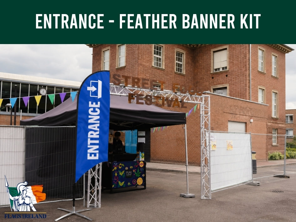 Entrance feather banner kit with blue banner and metal stand in front of a brick building.