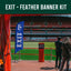 Blue 'EXIT' feather banner at a sports stadium with people taking a photo.