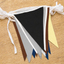 Colorful polyester triangle bunting flags on a wooden surface