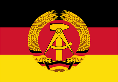 East Germany GDR Flag. The flag of the German Democratic Republic (GDR) is shown, featuring horizontal stripes of black, red, and yellow, with a central emblem of a golden hammer and sickle enclosed in a wreath of wheat.
