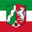 North Rhine Westphalia State Flag A flat graphic of the flag of Bad Wildbad, featuring horizontal stripes of green, white, and red, with a central shield displaying a green side with a white wave, a red side with a white rearing horse, and a white bottom section with a red rose.