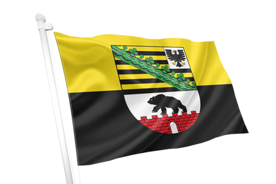Saxony Anhalt Province Flag. A waving flag on a white pole, featuring a yellow upper half and a black lower half, with a central coat of arms containing green, black, white, red, and yellow details.