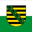 The flag of the Free State of Saxony features a horizontal two-colored design of white over green. It symbolizes the land of Saxony, with white and green representing its regional identity. The official state flag adds the Saxon coat of arms to the center. 