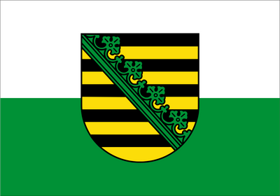 The flag of the Free State of Saxony features a horizontal two-colored design of white over green. It symbolizes the land of Saxony, with white and green representing its regional identity. The official state flag adds the Saxon coat of arms to the center. 