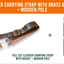 Leather carrying strap with brass bucket and wooden pole set, shown on a white background with an orange header. The strap is dark brown with a brass buckle and hardware, and the wooden pole has gold-toned accents.
