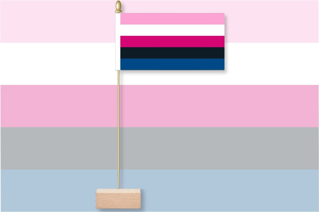 Flag with pink, blue, and black stripes on a striped background. Genderfluid Table Flag.