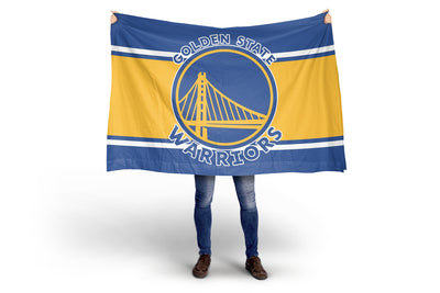 Person holding a Golden State Warriors flag on a white background