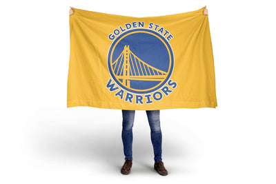 Person holding a Golden State Warriors flag on a white background