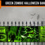 A green zombie-themed Halloween banner displayed on a black metal fence against a spooky gray background with silhouettes of a house, owl, bats, and a zombie. The banner features warning labels, a zombie face through cracked glass, and a zombie figure.