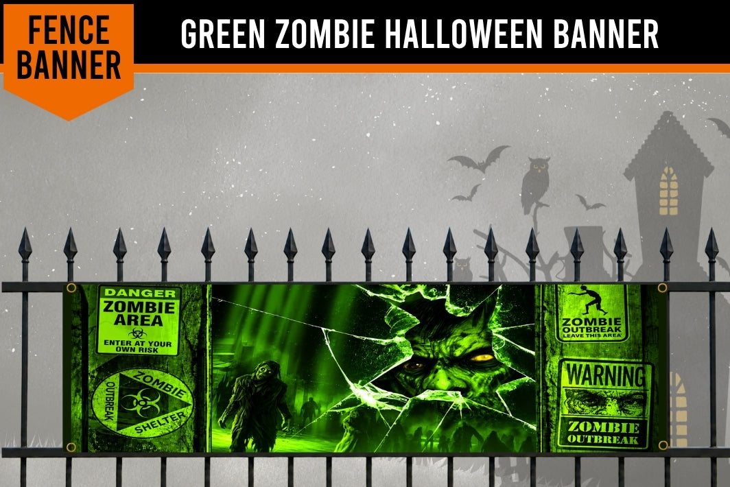 A green zombie-themed Halloween banner displayed on a black metal fence against a spooky gray background with silhouettes of a house, owl, bats, and a zombie. The banner features warning labels, a zombie face through cracked glass, and a zombie figure.