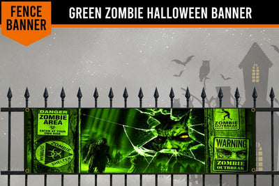 A green zombie-themed Halloween banner displayed on a black metal fence against a spooky gray background with silhouettes of a house, owl, bats, and a zombie. The banner features warning labels, a zombie face through cracked glass, and a zombie figure.