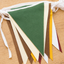 Color swatch for Heritage Fair Bunting with green, cream, brown, golden yellow, white, and maroon bunting flags 