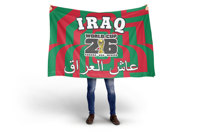 Person holding a large Iraq World Cup 2026 flag with red and green design.