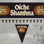 Halloween wall banner set featuring a large rectangular banner and matching pennant bunting with the Irish Gaelic phrase 'Oíche Shamhna'. The banners and pennants are black with cream lettering, orange pumpkin borders, and green-and-white shamrock motifs.