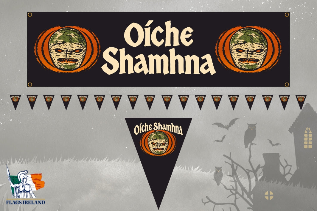 Halloween wall banner set featuring a large rectangular banner and matching pennant bunting with the Irish Gaelic phrase 'Oíche Shamhna'. The banners and pennants are black with cream lettering, orange pumpkin borders, and green-and-white shamrock motifs.
