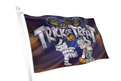 A Halloween-themed flag on a white pole, featuring the words 'Trick or Treat' in large white letters over a dark purple background, with illustrated pumpkins, a mummy, and Frankenstein's monster.