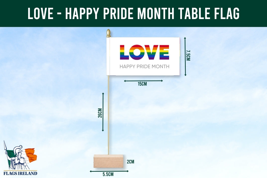 Table flag with 'LOVE' and 'Happy Pride Month' text, displayed with measurements against a blue sky background.