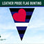 Leather Pride Flag Bunting with a heart design against a blue sky background, featuring the Flags Ireland logo.