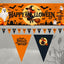 Halloween-themed flag and banner set shown on a gray background. The set includes a large rectangular orange banner with a witch riding a broomstick in front of a full moon, pumpkins, ghosts, bats, and the words “Happy Halloween,” plus a string of small triangular pennant flags below.