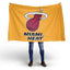 Person holding a Miami Heat flag on a white background