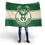 Person holding a Milwaukee Bucks flag on a white background
