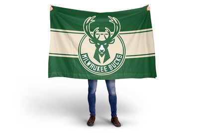 Person holding a Milwaukee Bucks flag on a white background