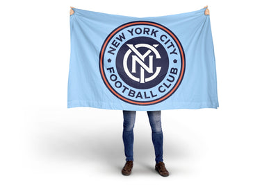 Person holding a New York City Football Club flag against a white background